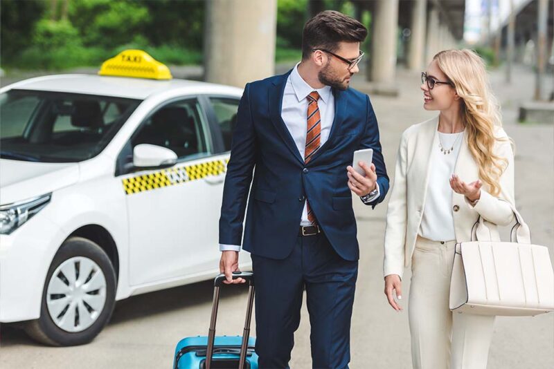 Couple infront of taxi 