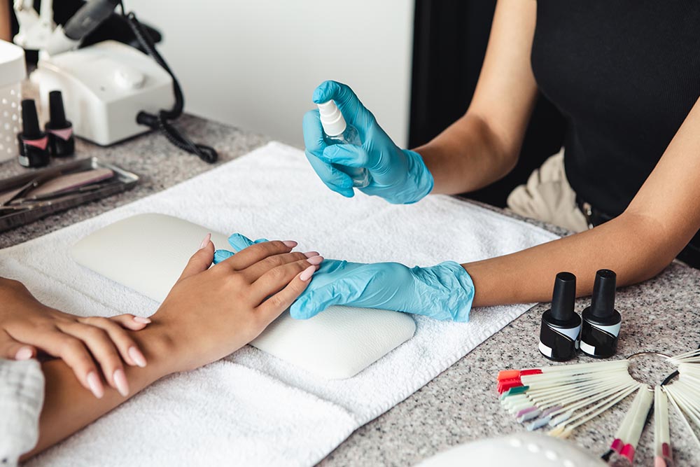 Expert staff at spa treating the hands