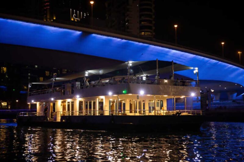  People enjoying in a cruise floating restaurant of Dubai 