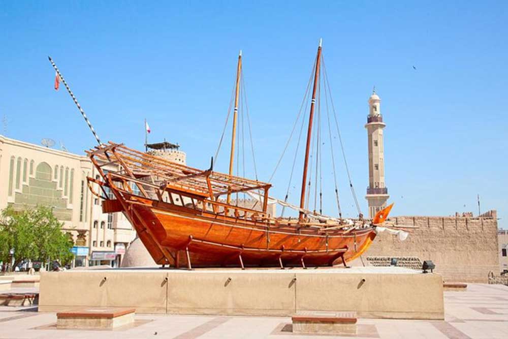 ship under a blue day sky in Ras Al Khaimah National Museum