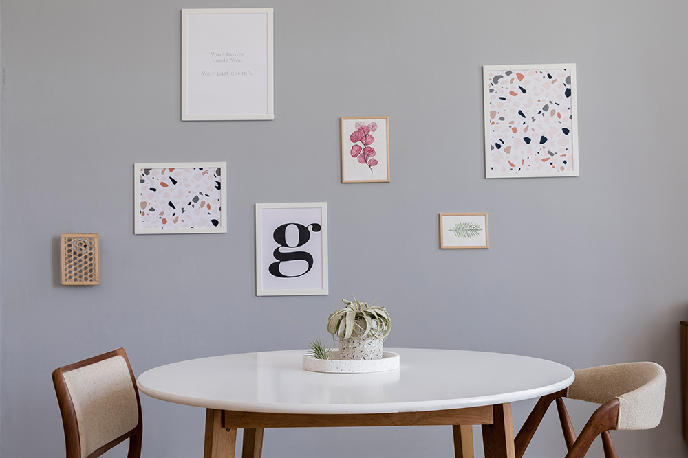 Using minimalist designs and colours to create an elegant-looking gallery wall 