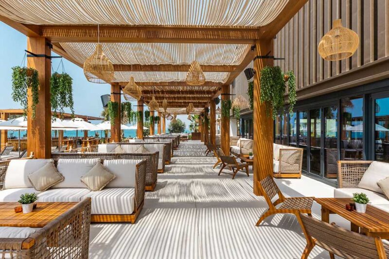 brown and white themed sitting area with beach view, rak, uae.