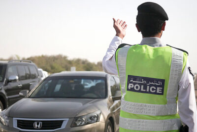 A policeman guiding the traffic in UAE