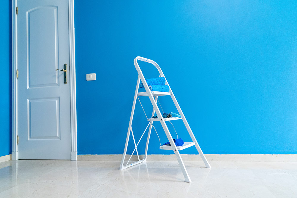 Repainting a home to attract potential buyers