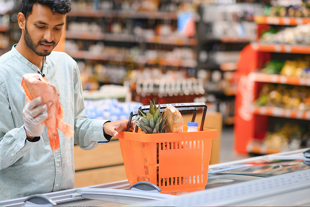 A man doing grocery from Viva supermarket in UAE 