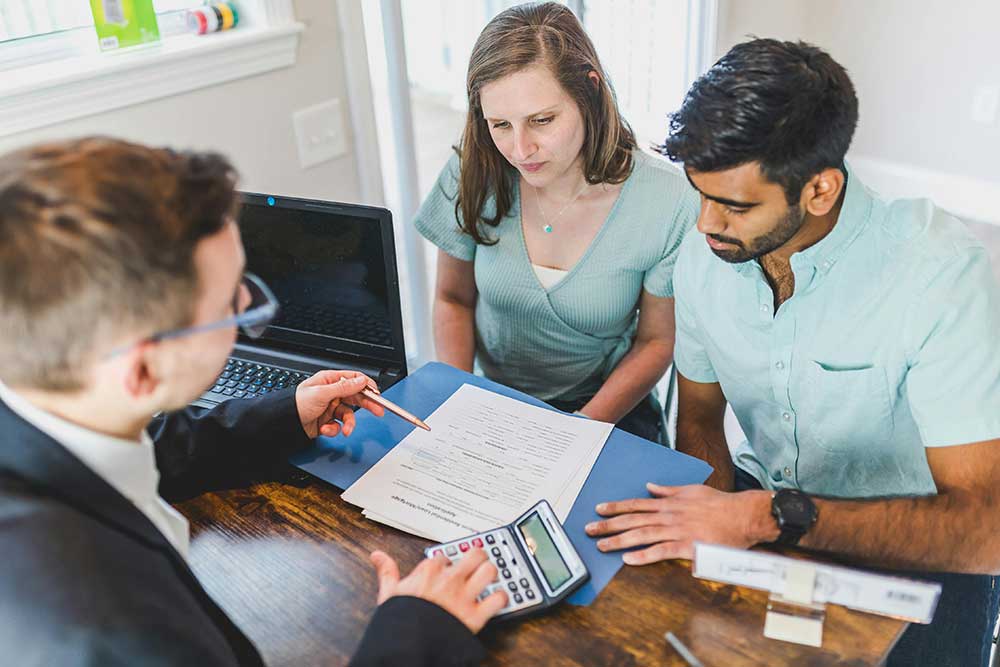 A consultant guiding the foreigners about property ownership in Sharjah 