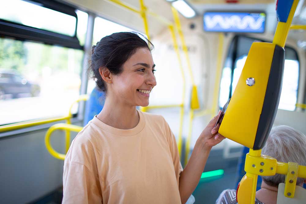 Woman using Sayr card in Rak bus 