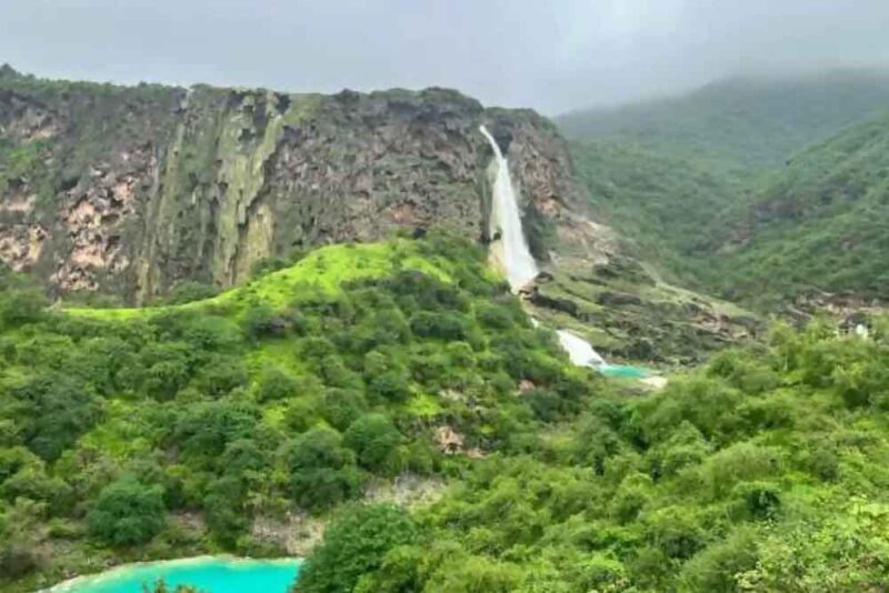 Image of a green valley with a waterfall