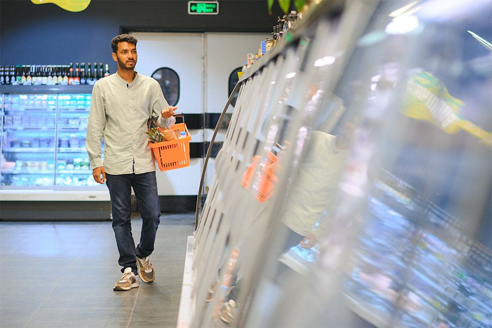 Man shopping at ansar gallery in al karama