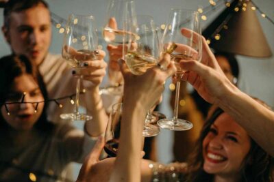 Selective Focus Photography of Several People Cheering Wine Glasses