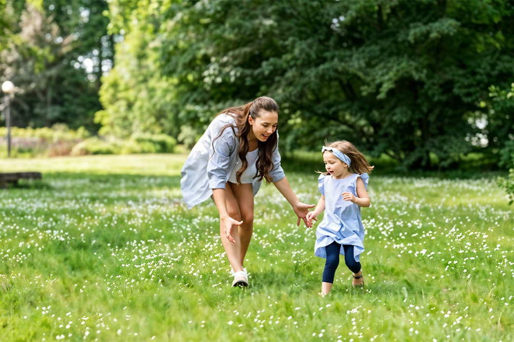 running around with children at creek park 