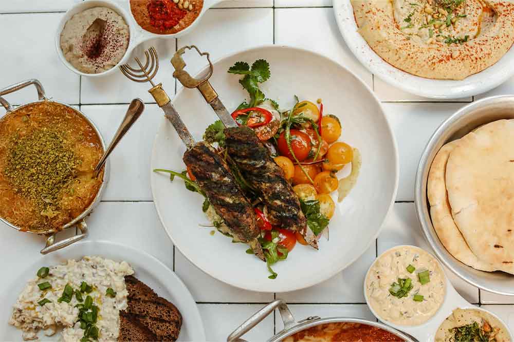 Traditional Foods over White Ceramic Tiles