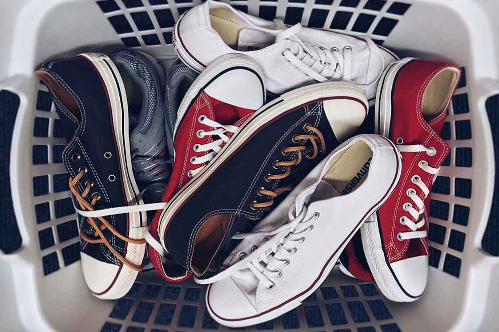 clean sneakers in a laundry basket 