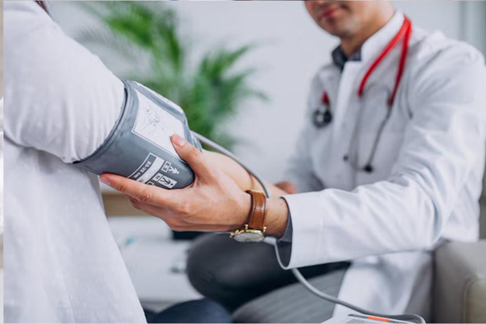 Physician measuring patients’s blood pressure 