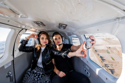 Couple taking selfie during helicopter tour