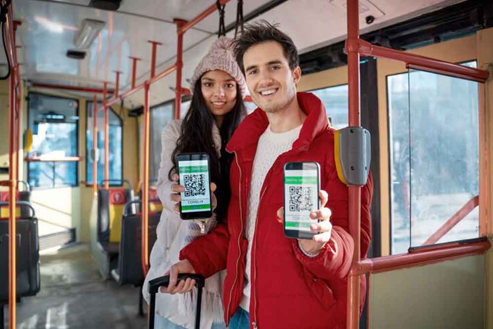 People showing QR code on a bus