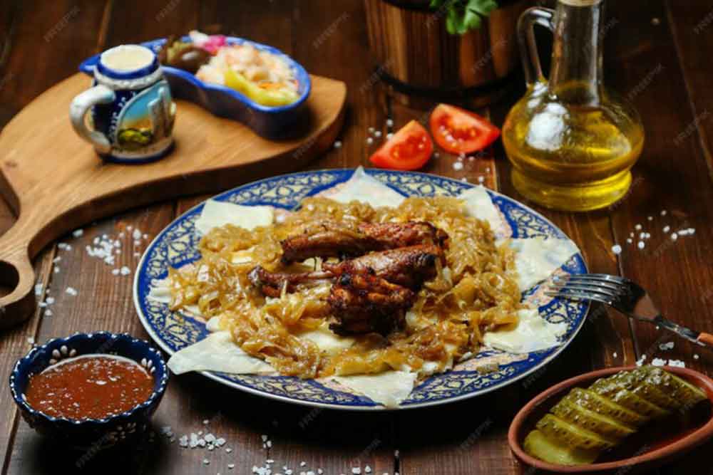 Fried chicken with onions on the table