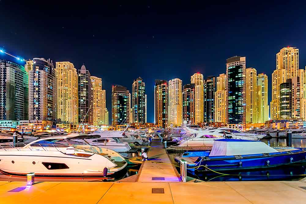 yacht in water on a tour at night