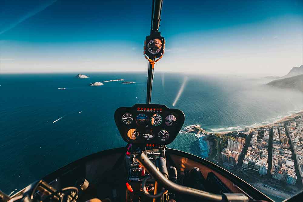 Flying helicopter above the sea