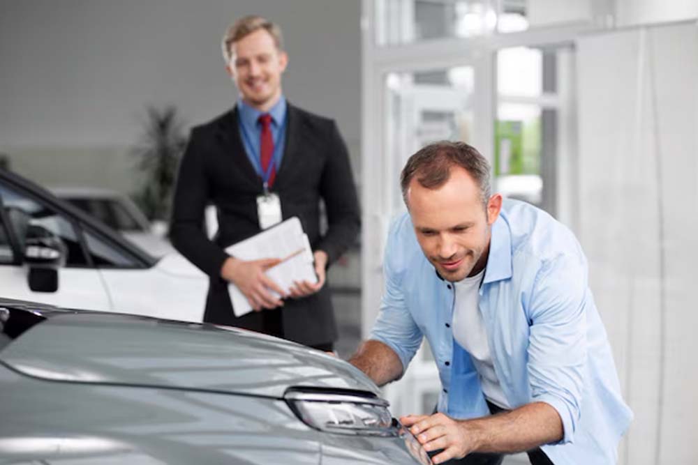 Man inspecting a car