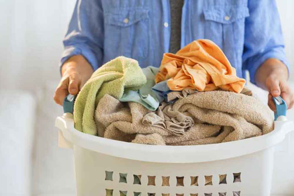 person holding laundry basket