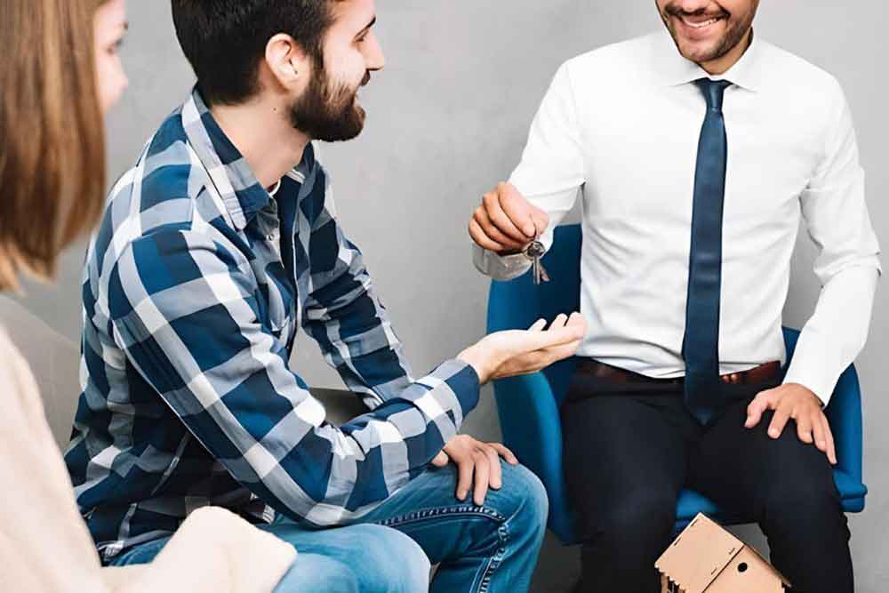 Couple getting keys from a man