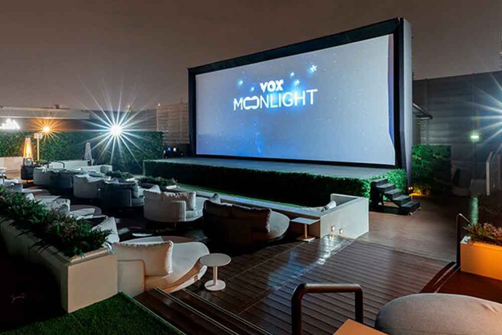 Outdoor cinema with white chairs