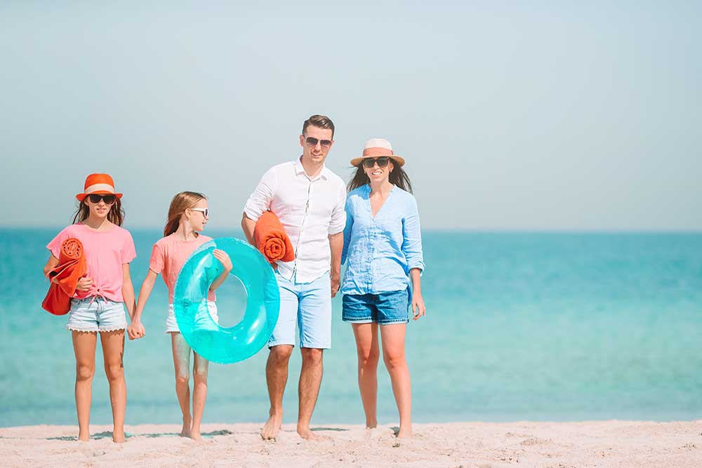 Family at a public beach in dubai 