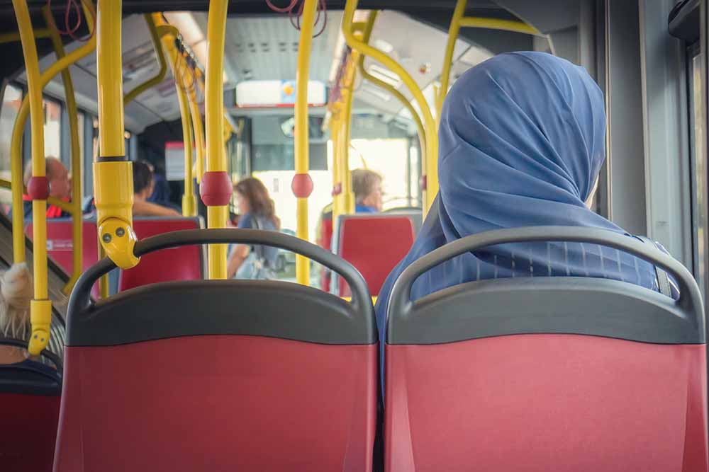 Woman travelling in RAK Bus 