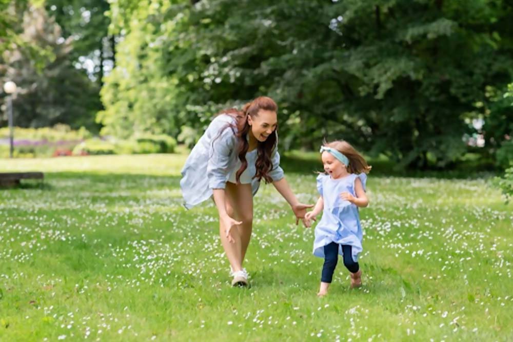 running around with children at creek park 