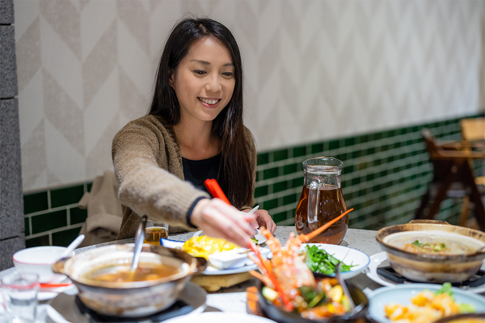 Korean woman enjoying her traditional meal 