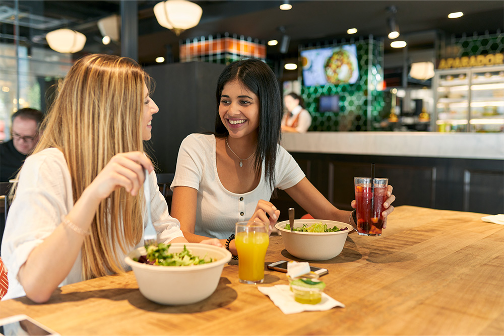 Two friends enjoying vegan meal