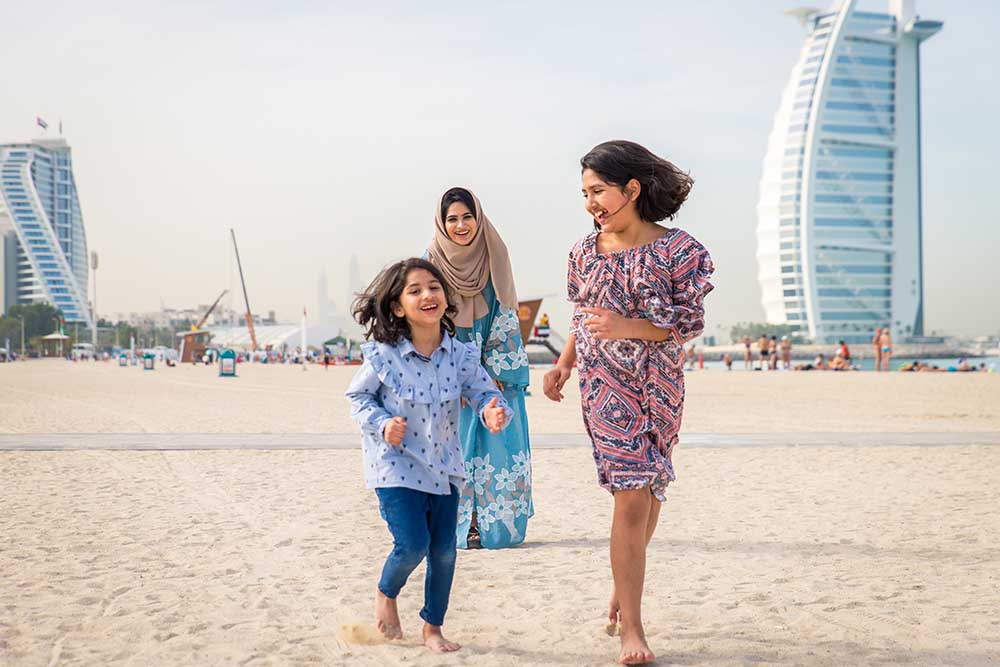 Happy family at jumeirah 3 beach