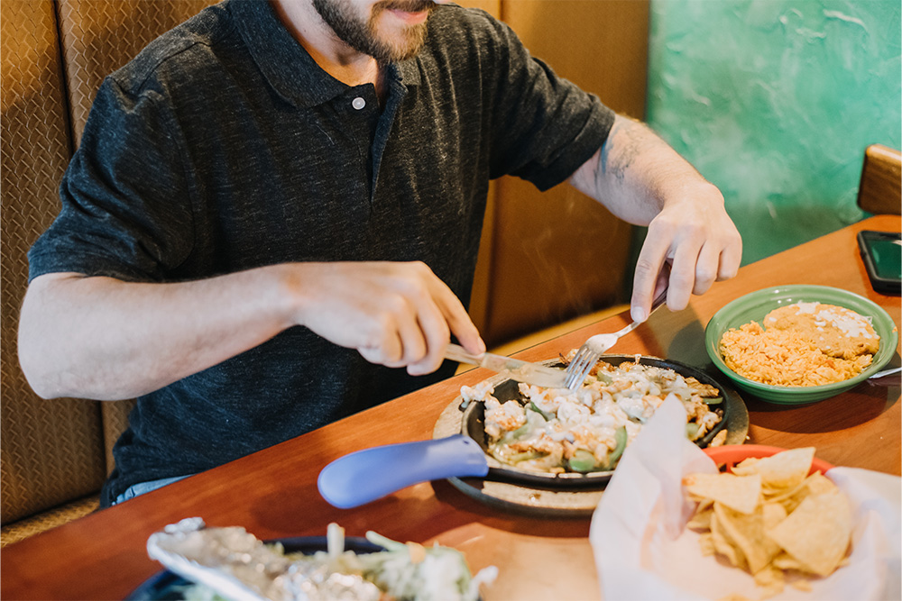 Man eating mexican food in a restaurant