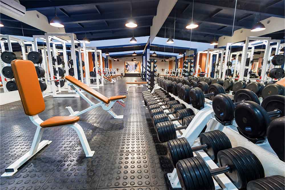 Fitness equipment and dumbbells in a modern gym 