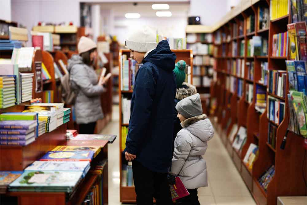  looking for books in a bookstore 