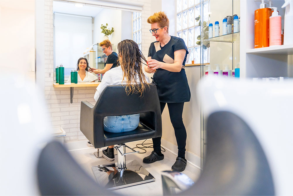 hair dresser working in an Abu Dhabi hair salon