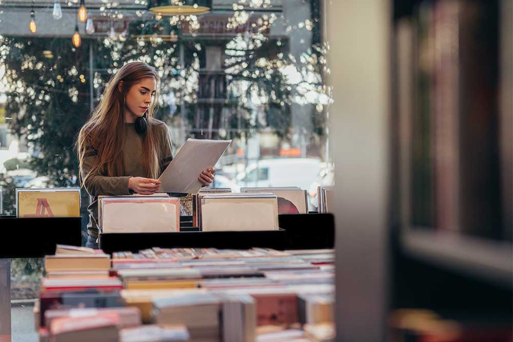 women selecting a book in Dubai bookstore