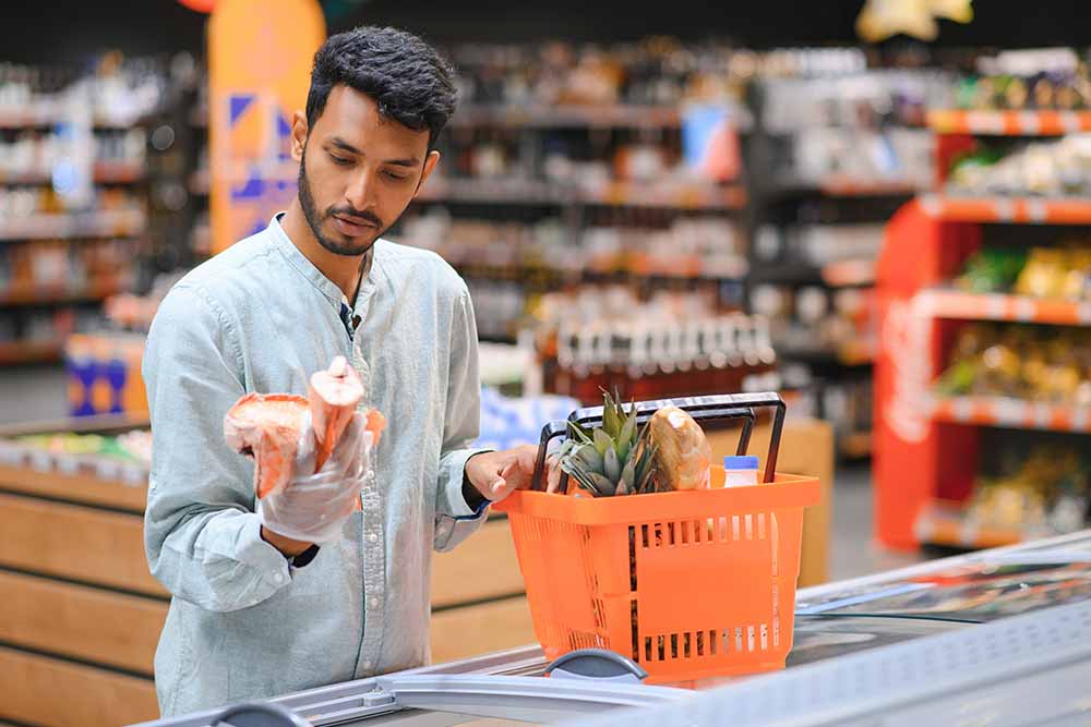 A man shopping grocery at a supermarket