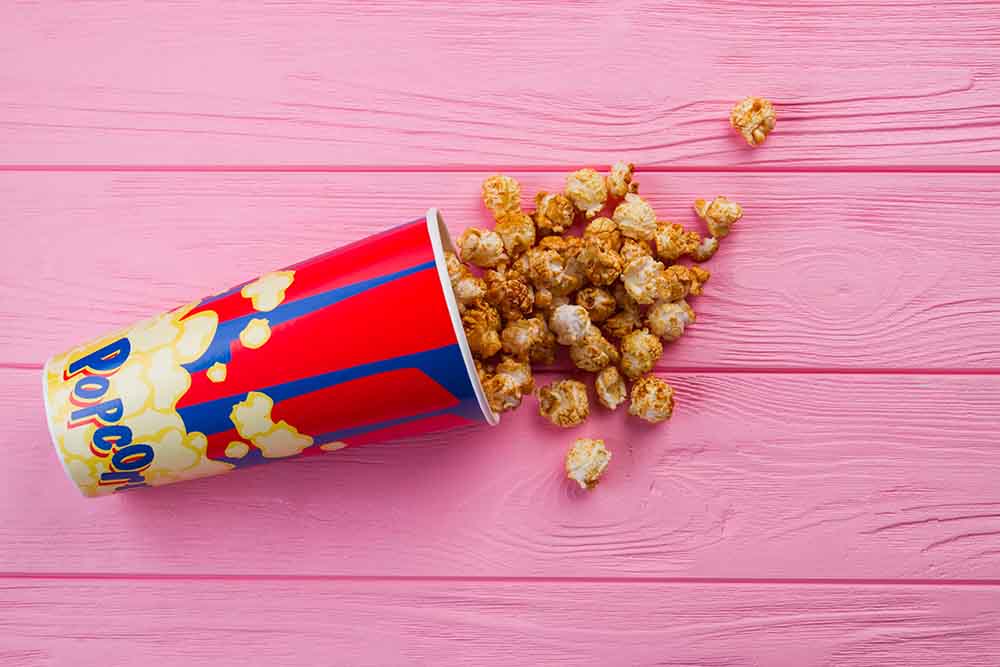 Popcorn falling from an overturned bucket