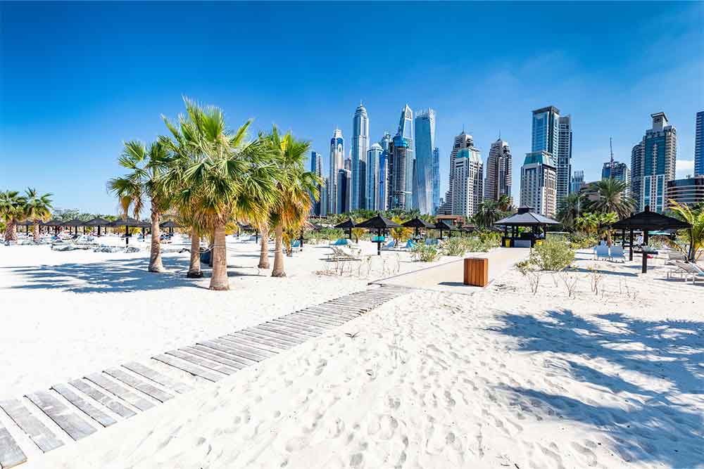 The beach of Jumeirah 3 with skyscrapers 