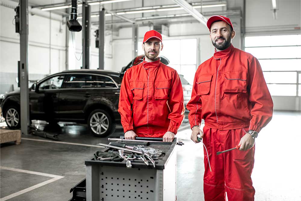 Servicemen in a car garage in Dubai