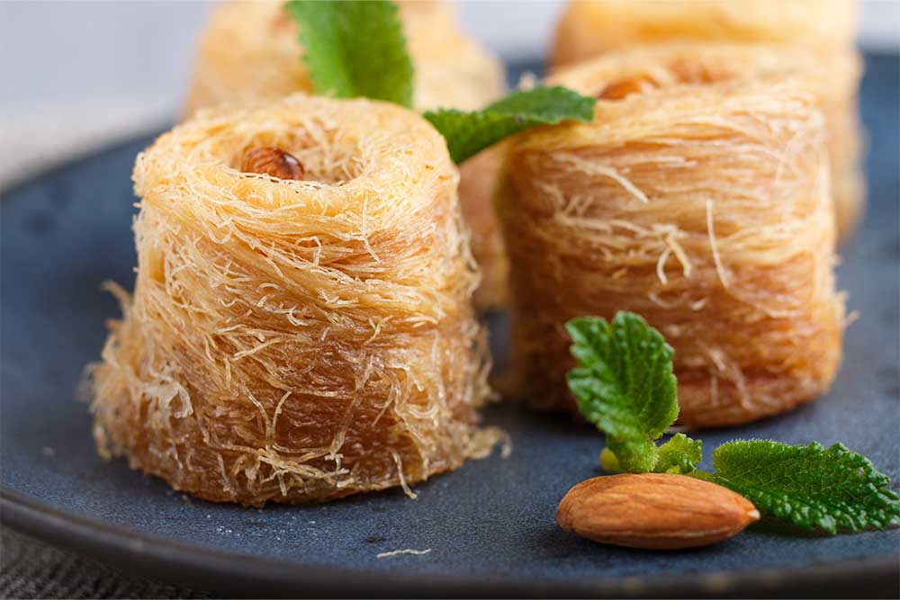  Kunafa rolls in a blue ceramic plate