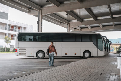 A woman waiting for a bus at Sharjah bus stop