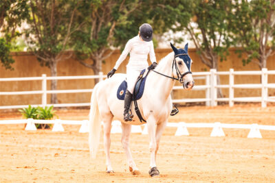 A woman learning horse riding in Abu Dhabi