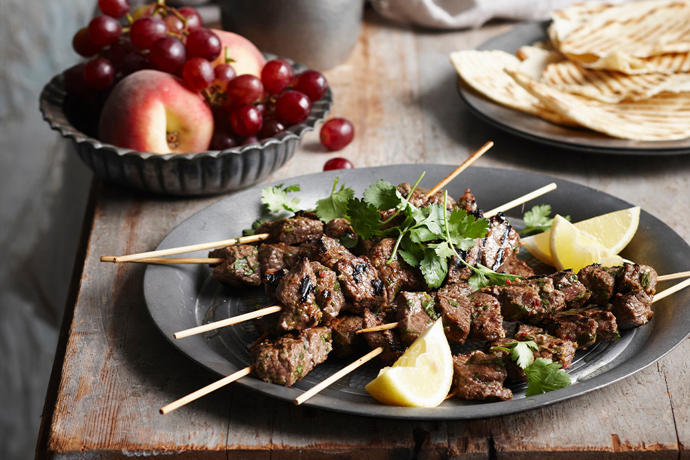 Lamb skewers beautifully presented in a dish 