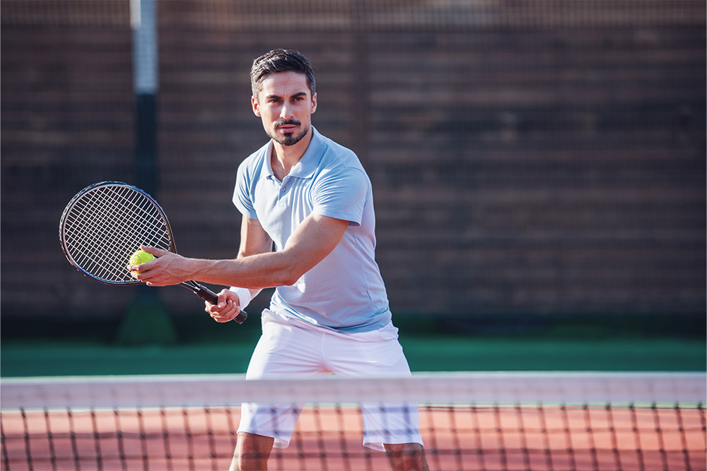 playing tennis at a club in Dubai