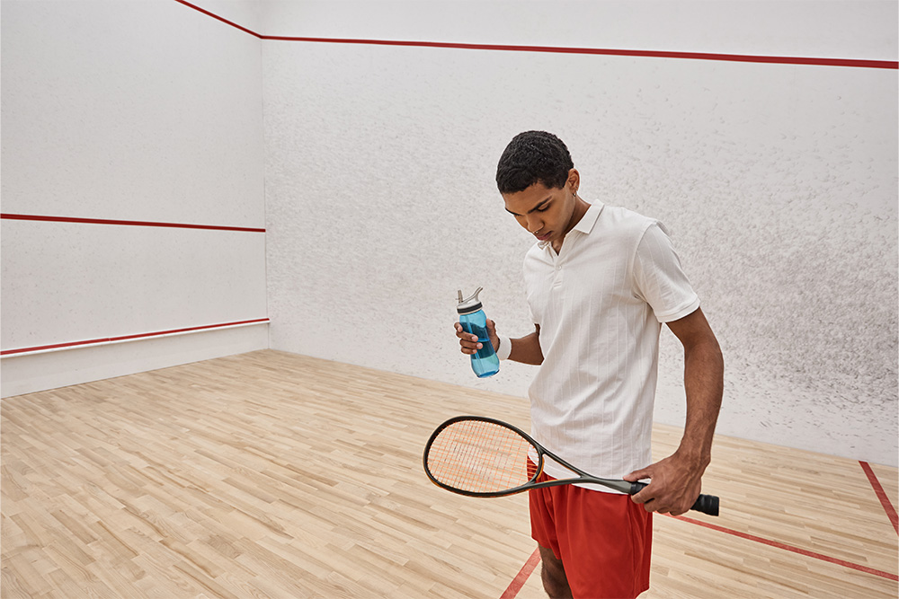 taking a water break after playing squash 