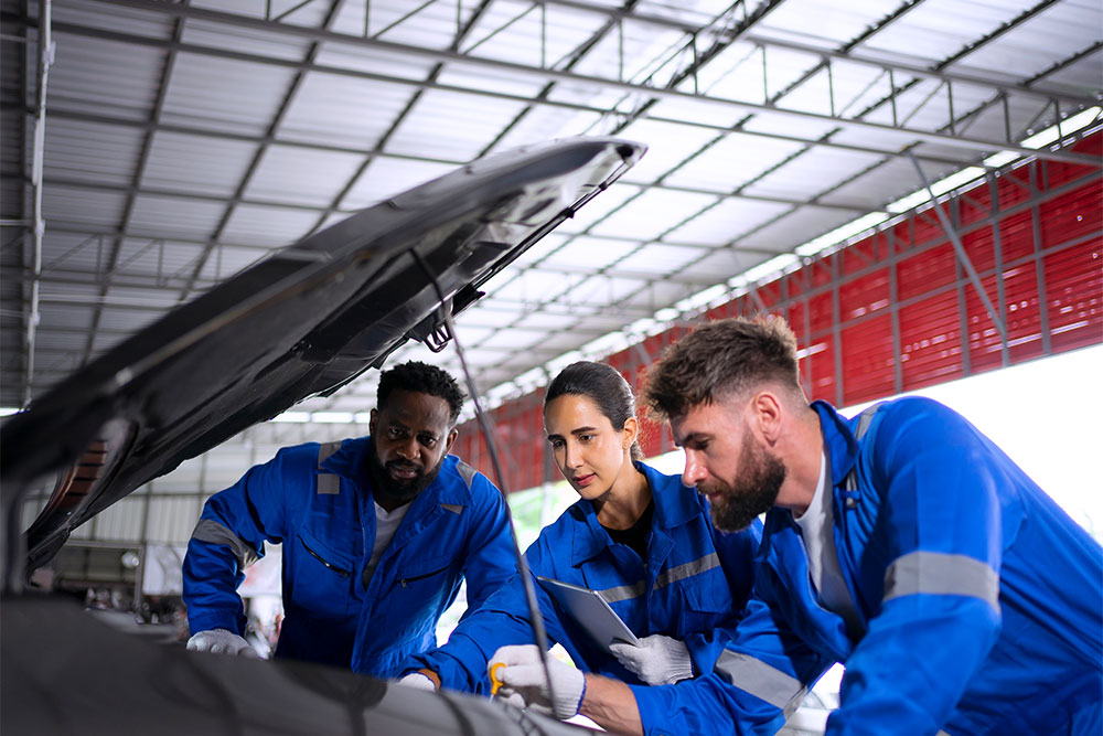 Discussing issues in a car at a garage