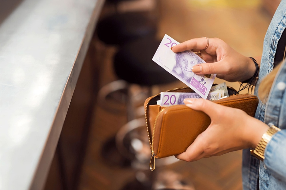 Woman paying with cash